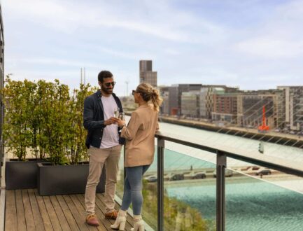 Couple Balcony Drinks Wide